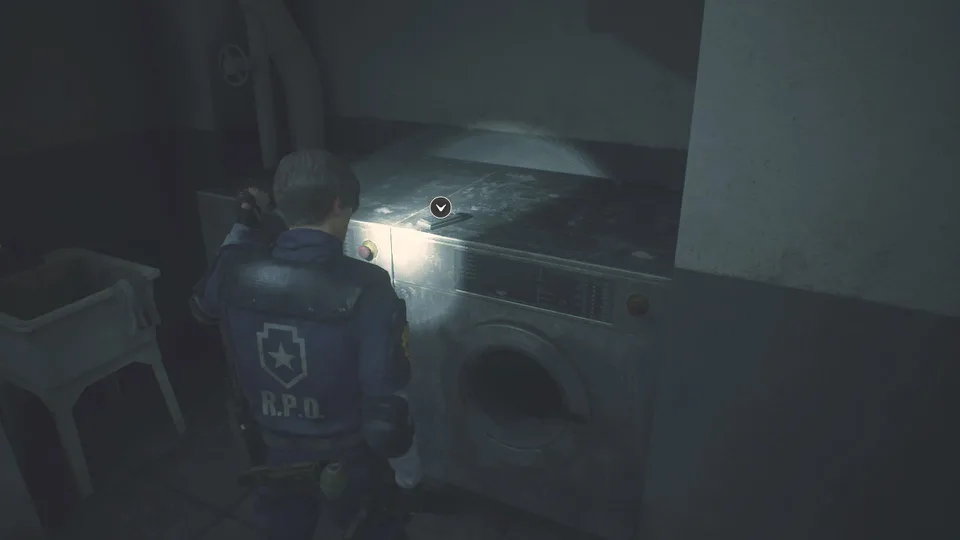 resident evil 2 20190206094919 d6qy Personagem próximo a uma máquina de lavar